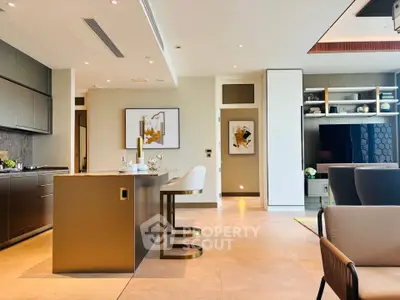 Luxurious open-plan kitchen and living room with modern decor and elegant furnishings.