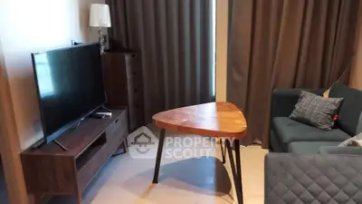 Modern living room with stylish furniture and large TV