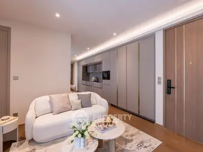 Modern living room with elegant decor and cozy seating in a stylish apartment.
