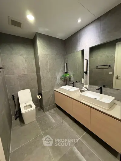 Modern bathroom with dual sinks and sleek design in luxury apartment