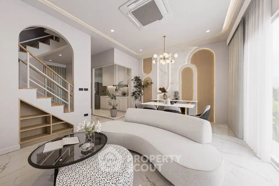 Luxurious modern living room with elegant curved sofa and stylish dining area, featuring contemporary lighting and open layout.
