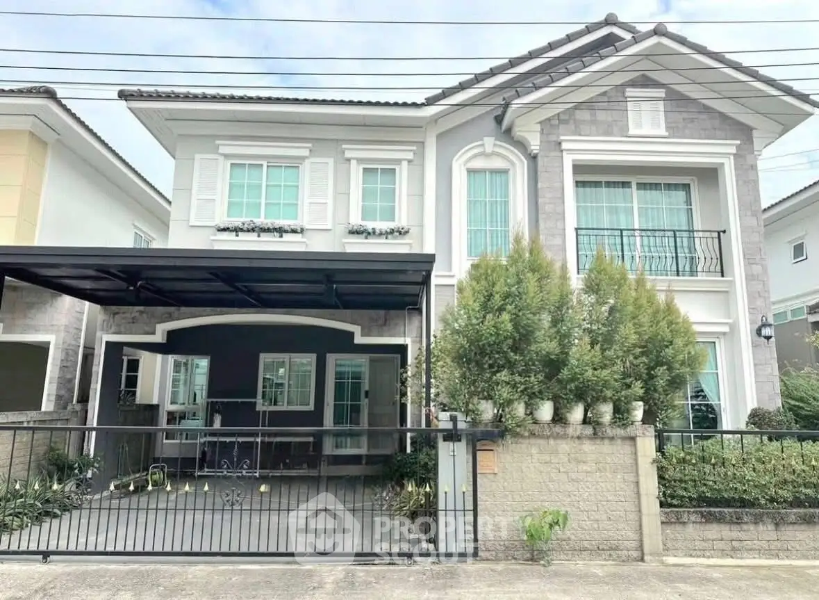 Elegant two-story house with modern facade and spacious driveway