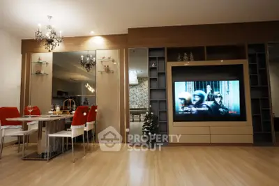 Modern living room with elegant dining area and large TV