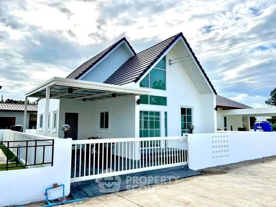 Charming modern white house with pitched roof and spacious driveway