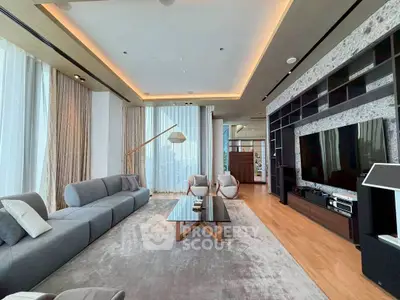 Luxurious modern living room with elegant decor and spacious seating area.