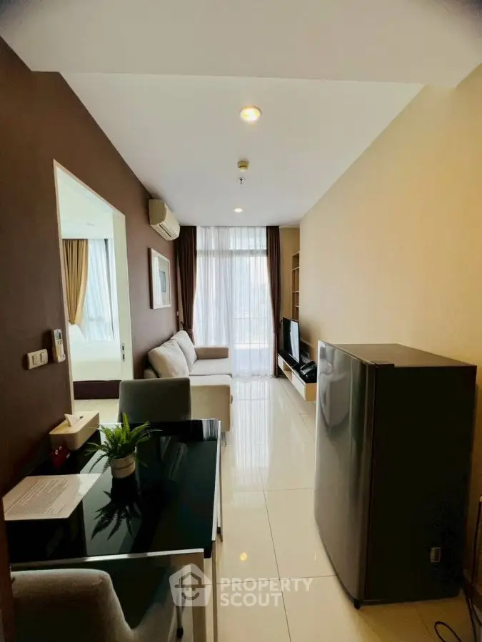 Modern living room with sleek furniture and natural light, perfect for urban living.