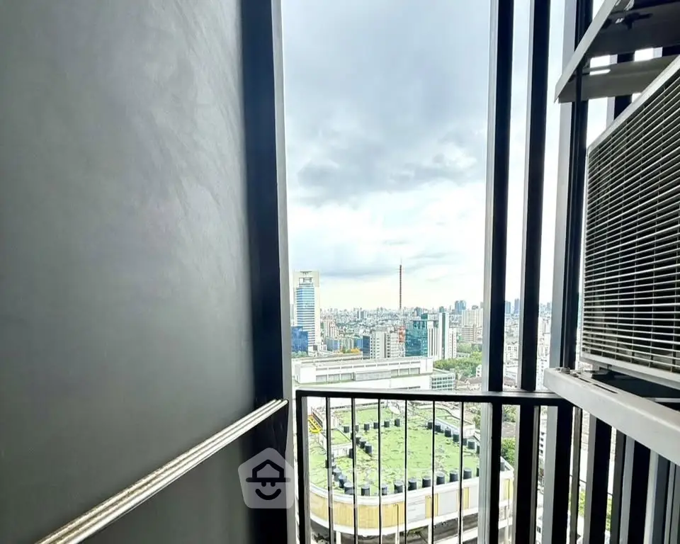 Stunning cityscape view from a high-rise balcony, perfect for urban living enthusiasts.