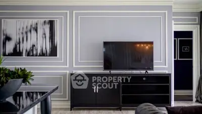 Elegant living room with modern TV stand and abstract wall art