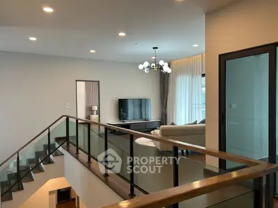 Spacious modern living room with elegant decor and large windows for natural light.