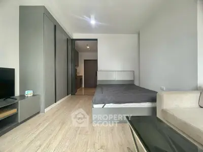 Modern studio apartment with sleek design and cozy furnishings, perfect for urban living.