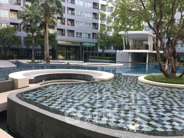 Luxurious apartment complex with stunning pool and modern architecture