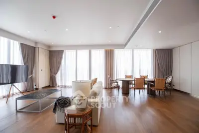 Spacious modern living room with elegant decor and large windows