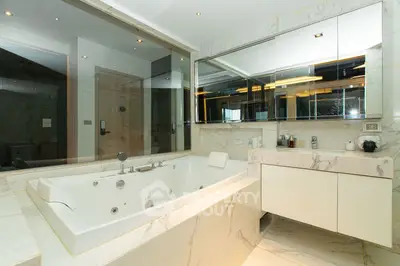 Luxurious marble bathroom with jacuzzi tub and modern vanity