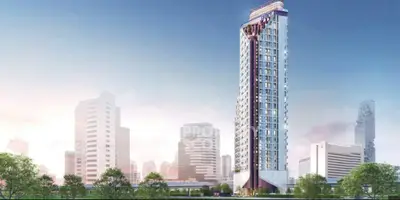 Stunning modern high-rise building with panoramic city views and lush greenery.