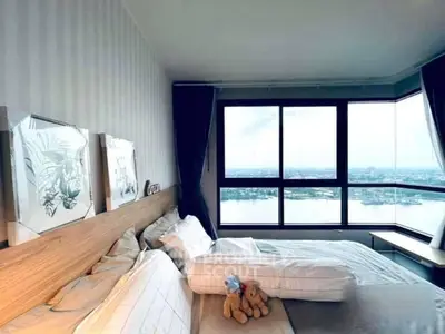 Luxurious bedroom with stunning river view and elegant decor