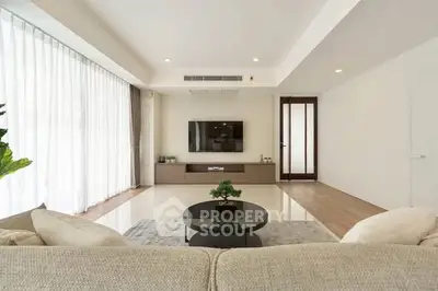 Spacious modern living room with sleek design and natural light