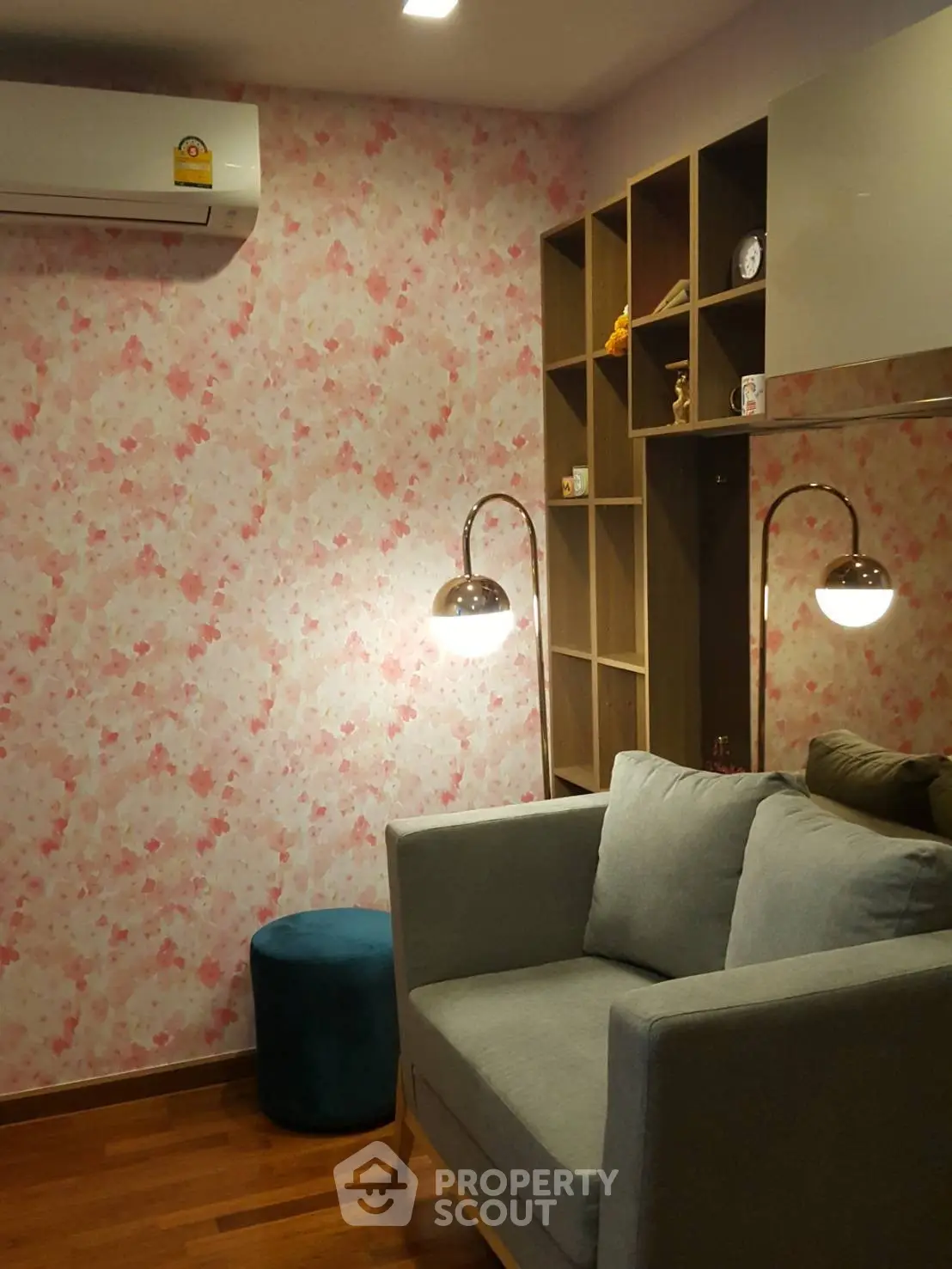 Cozy living room with floral wallpaper and modern furniture