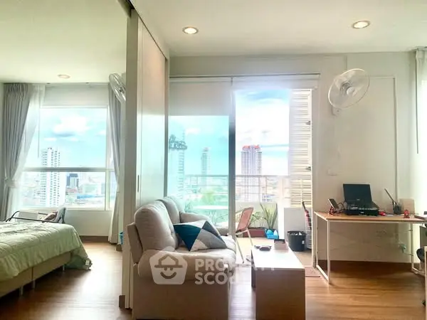 Modern studio apartment with city view and cozy interior design