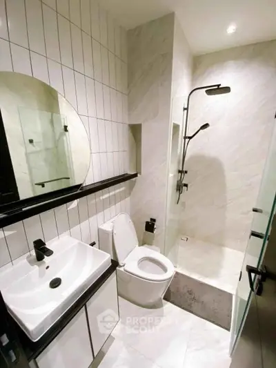 Modern bathroom with sleek fixtures and spacious shower area