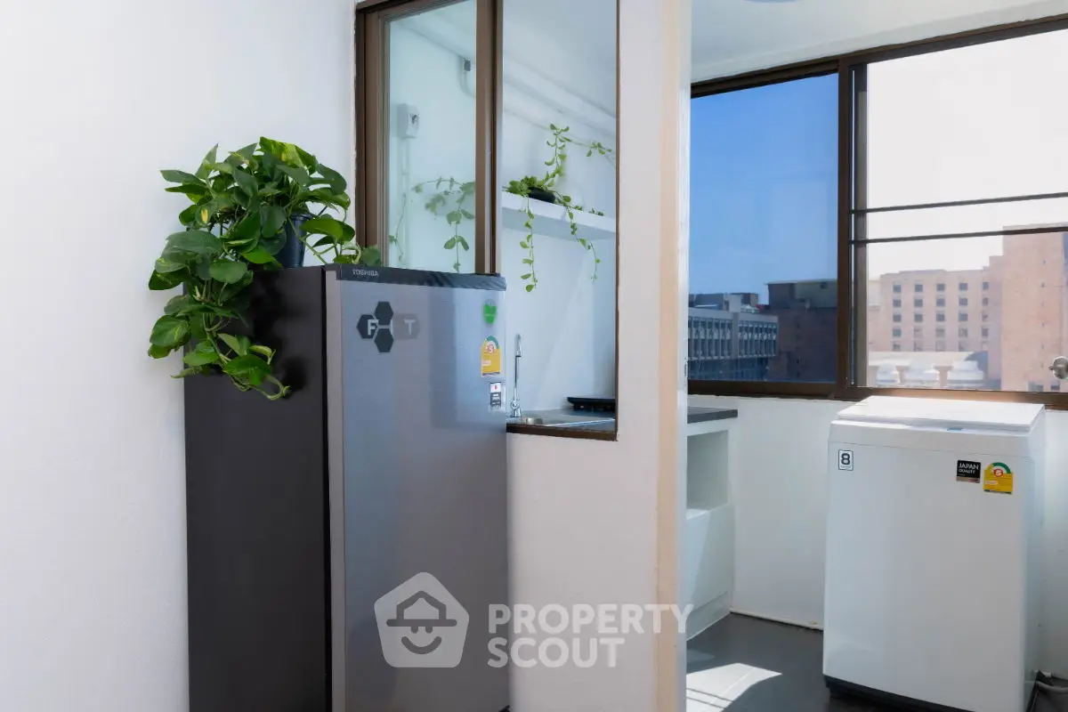 Modern laundry area with city view and energy-efficient appliances.