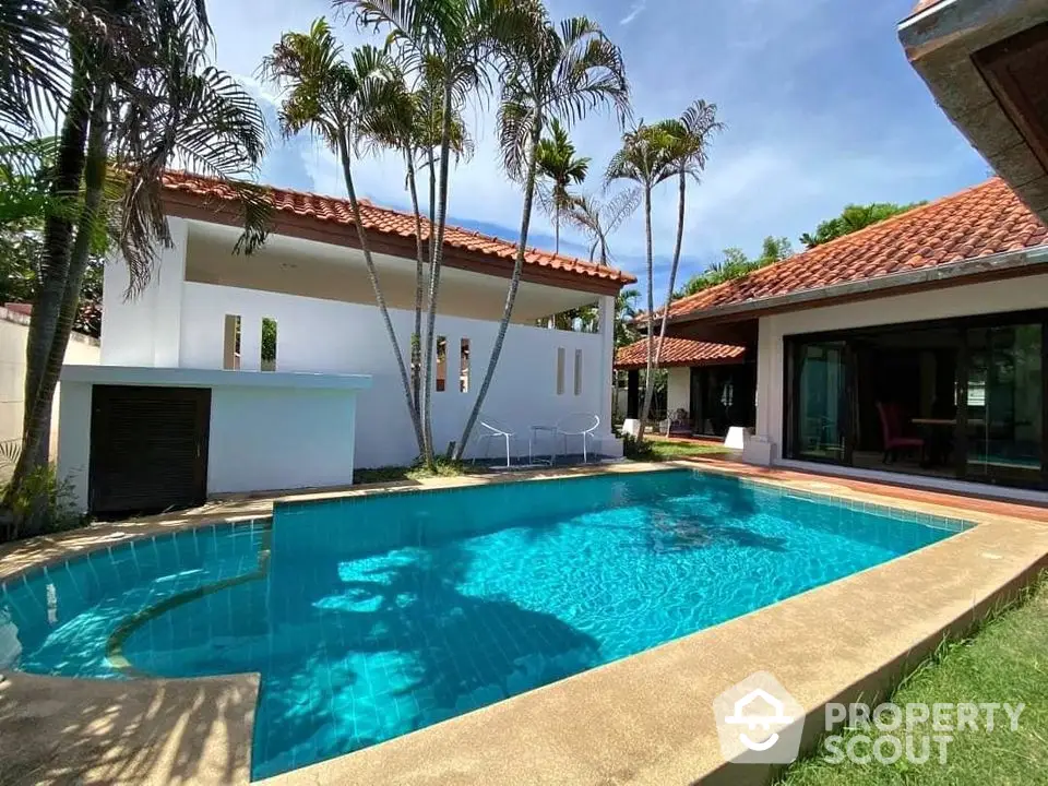 Stunning villa with private pool and lush garden, perfect for luxury living.