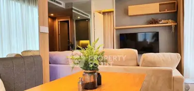 Modern living room with cozy beige sofas and stylish wooden decor