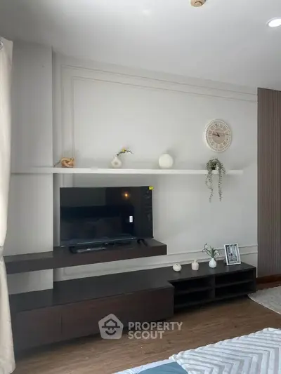 Modern living room with sleek TV unit and stylish decor