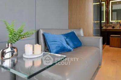 Modern living room with sleek leather sofa and elegant decor