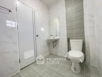 Modern bathroom with sleek tiles and minimalist fixtures