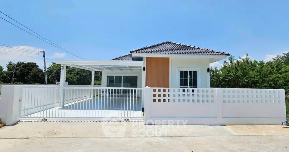 Charming single-story house with modern design and spacious driveway in serene neighborhood.