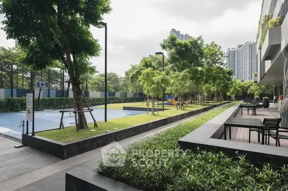 Modern residential garden with lush greenery and outdoor seating area