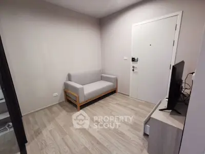 Cozy minimalist living room with modern sofa and TV setup