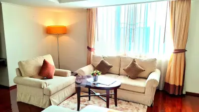 Cozy living room with elegant furniture and natural light, perfect for relaxation and entertaining guests.