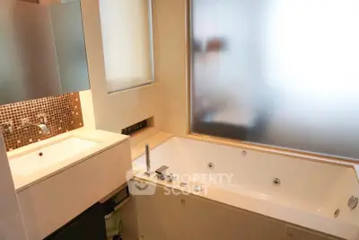 Luxurious bathroom with modern fixtures and spacious bathtub