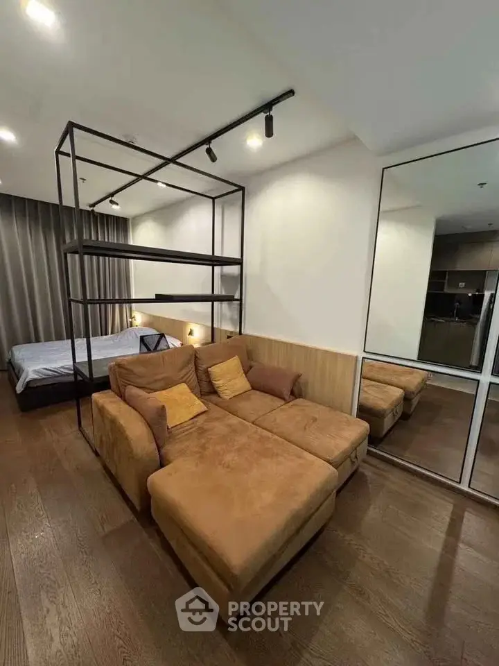 Modern studio apartment with cozy living area and stylish decor
