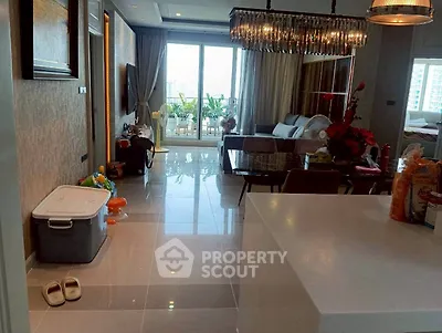 Modern living room with open layout and balcony view in luxury apartment