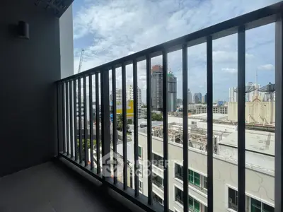 Spacious balcony with city skyline view in modern apartment building
