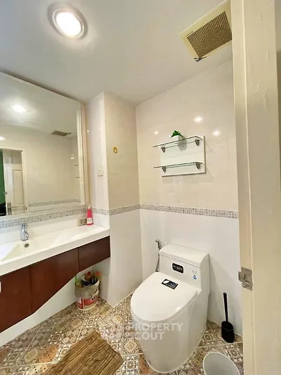 Modern bathroom with stylish fixtures and elegant tile flooring