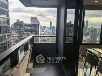 Stunning city view from modern high-rise balcony with sleek design and ample natural light.
