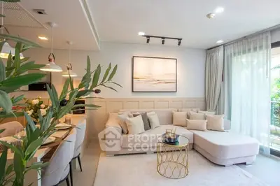 Stylish living room with modern decor and large windows for natural light.