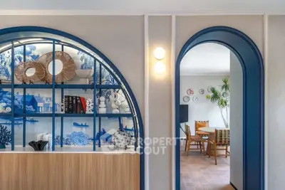 Stylish interior with archways and decorative shelving in modern living space