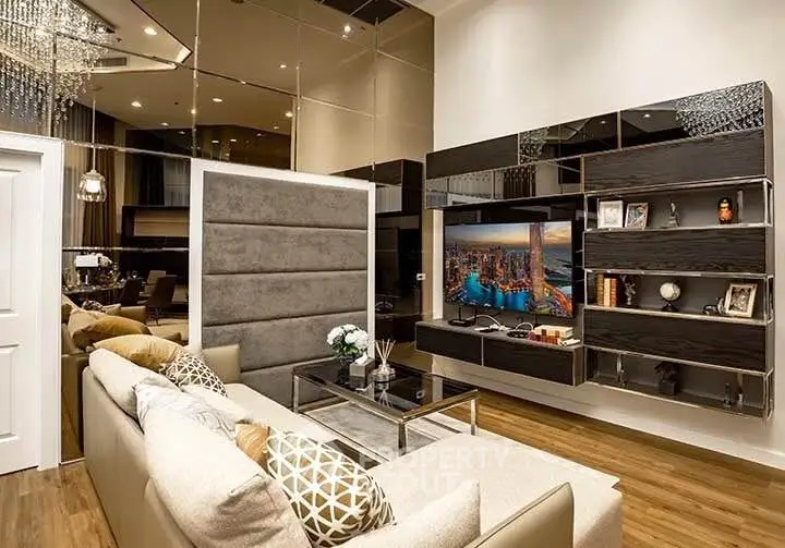 Luxurious modern living room with elegant decor and large wall-mounted TV