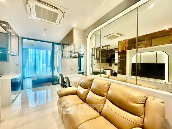 Luxurious modern living room with leather sofa and glass partition, featuring sleek design and ample natural light.