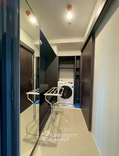 Modern laundry room with sleek design and Samsung washing machine