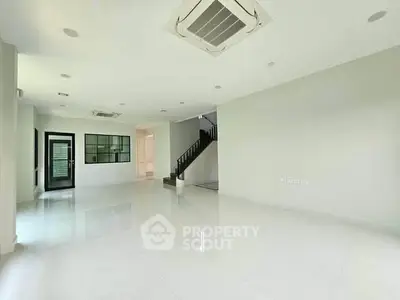 Spacious modern living room with sleek design and air conditioning