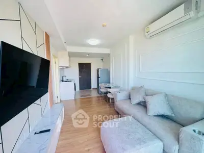 Modern living room with stylish decor and open kitchen layout