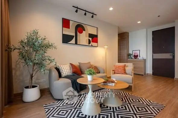 Stylish modern living room with abstract art and cozy seating area.