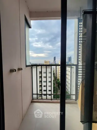 Charming balcony view with cityscape backdrop, perfect for urban living enthusiasts.