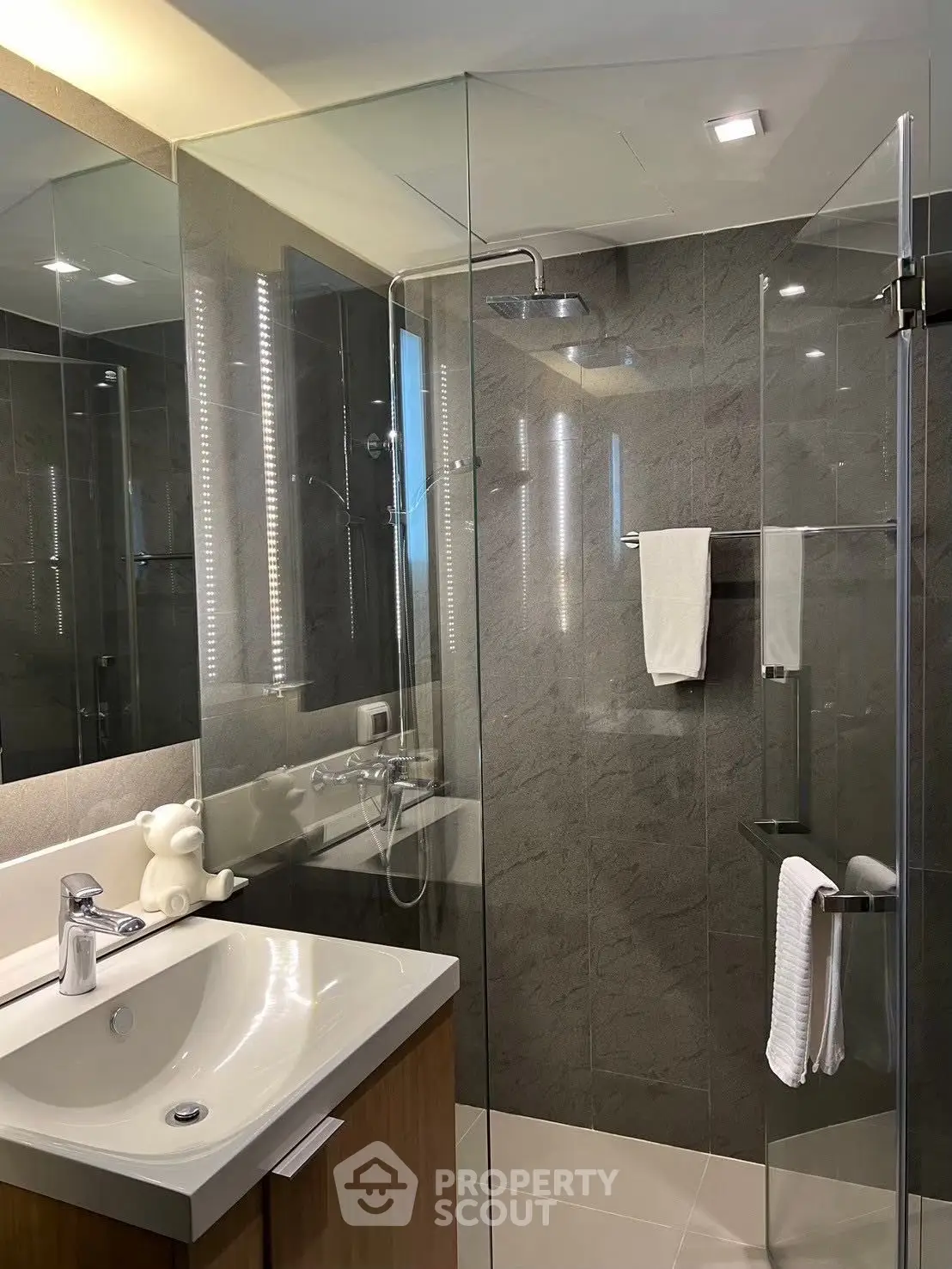 Modern bathroom with glass shower and sleek fixtures