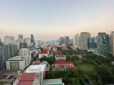 Stunning cityscape view showcasing urban skyline and lush greenery, perfect for real estate investment.